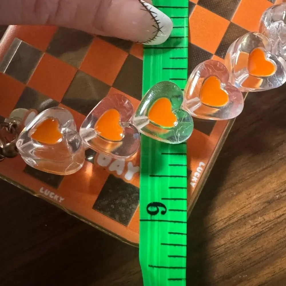 Orange Checkered Phone Case with Heart Charms